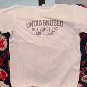 White Graphic Tee "Undiagnosed But Something Ain't Right"